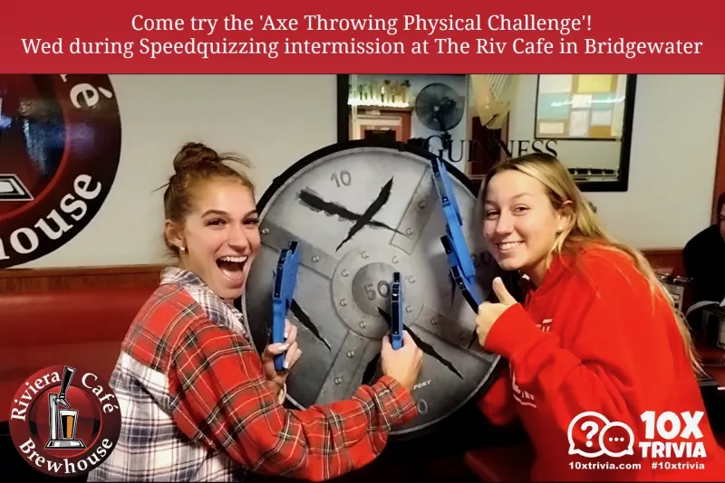Two guests trying the axe throwing challenge at the Riviera Cafe